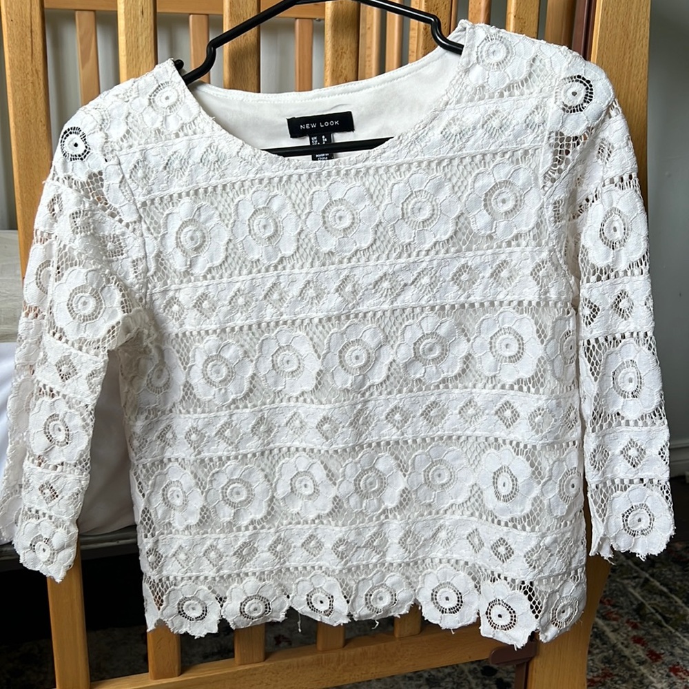 Half sleeve white blouse with floral detail